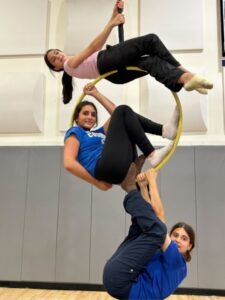 8th-grade students from The Cushman School performing acrobatics and aerial arts during the Centennial Circus Celebration with Miami Circus Arts professionals.