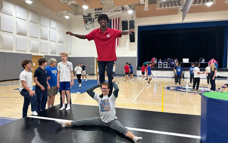 8th-grade students from The Cushman School performing acrobatics and aerial arts during the Centennial Circus Celebration with Miami Circus Arts professionals.