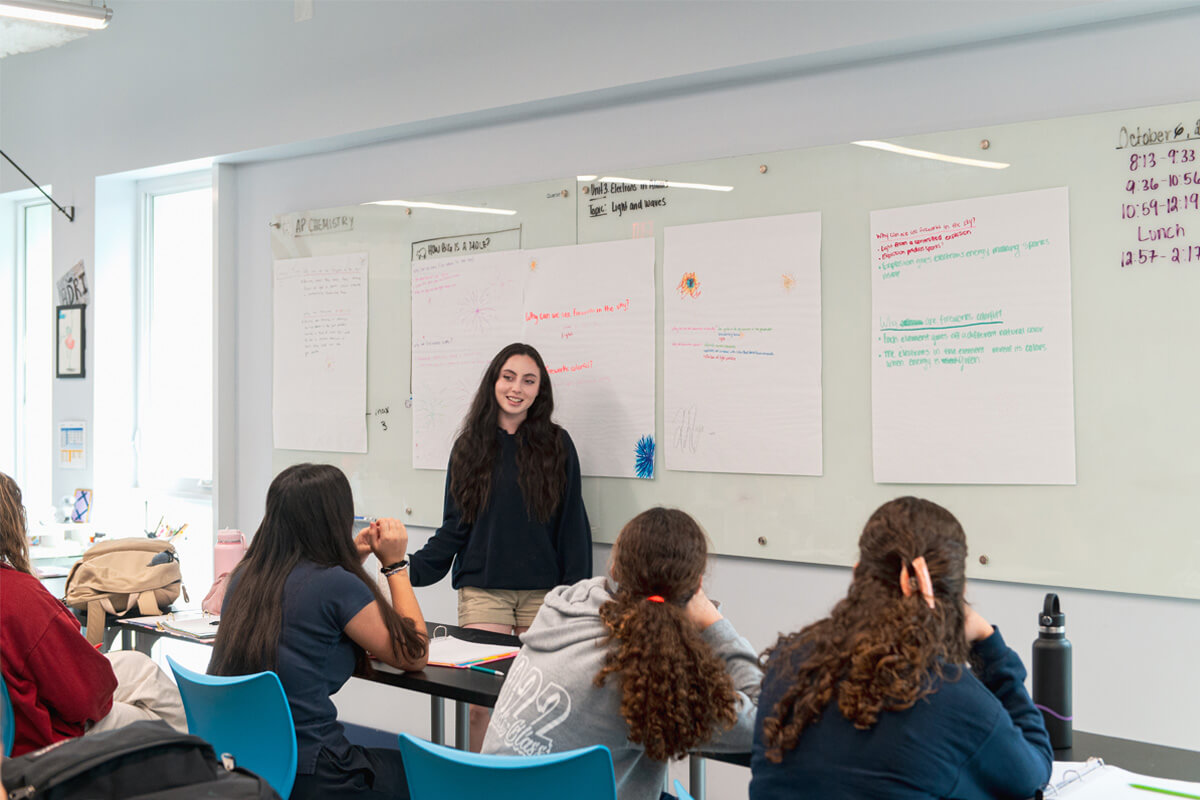 Students at Cushman High School in Miami giving a presentation during open house