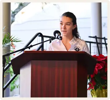Female Cushman student speaking at assembly.